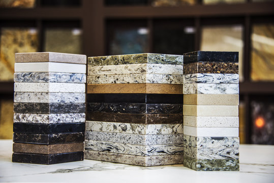 Various of stone color samples for kitchen countertops, granite, marble and quartz in different colors. Brown, gray, dark , white and black.
