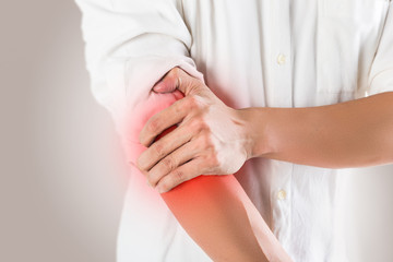 Close-up on business man with wrist pain.