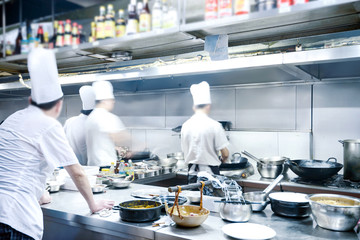 motion chefs of a restaurant kitchen