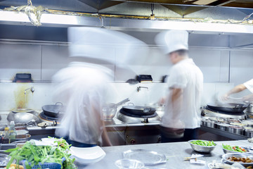 motion chefs of a restaurant kitchen