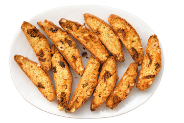 Classic Italian biscotti cookies on plate isolated a white backg
