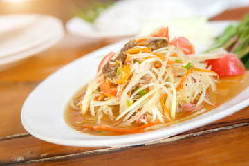 Famous Thai food, Papaya salad or what we called "Somtum" in Thai with sunlight.
