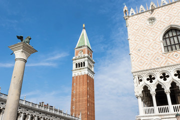 Fototapeta na wymiar Doges Palace, Campanile and Column with statue of Lion in St. Mark's Square (Venice Italy). Horizontally. 