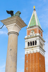 Fototapeta na wymiar Campanile and Column with statue of Lion in St. Mark's Square (Venice Italy). Vertically. 