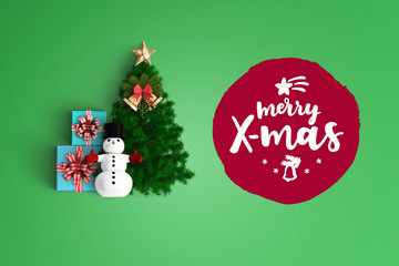 merry christmas and chirstmas tree on color background