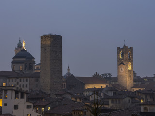 Obraz premium Bergamo - Old city (Citta Alta). One of the beautiful city in Italy. Lombardia. Evening landscape. The clock tower called Il Campanone (the big bell) and towers