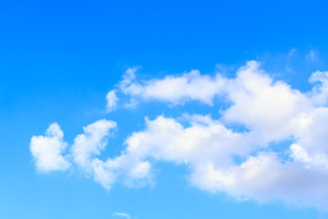 Naklejka na ściany i meble Blue sky background with white clouds and rain clouds. The vast blue sky and clouds sky on sunny day. White fluffy clouds in the blue sky.