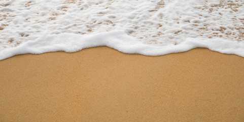 Bubbles waves on the beach texture background.