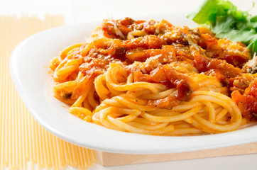 Italian cooked spaghetti with bolognese and parmesan