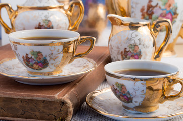 Vintage porcelain coffee cups with hot espresso
