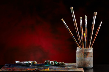 Paint brushes with a palette.