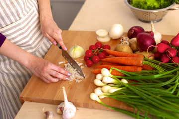Young Woman Cooking in the kitchen. Healthy Food