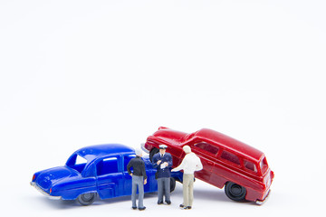 Miniature tiny toys car crash accident damaged.Insurance on the