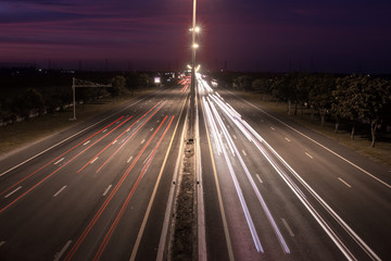 Obraz premium Speed Traffic at light trails on motorway highway at night,backg