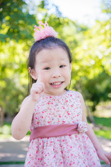 Little asian cute girl smiling in park