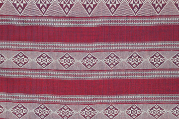 Red cotton fabric in Thai pattern for background or texture