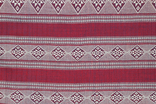 Red cotton fabric in Thai pattern for background or texture