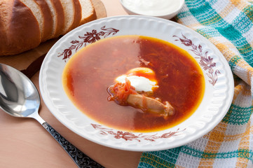 Plate of delicious soup from beet with sour cream and chicken 