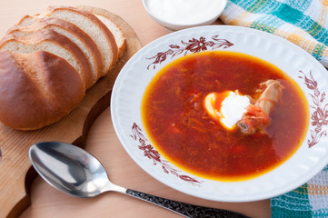 Bowl of soup and sliced white bread