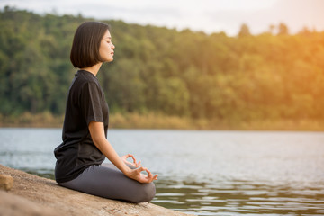 Fototapeta premium asian woman Yoga relax in nature to relax outdoor