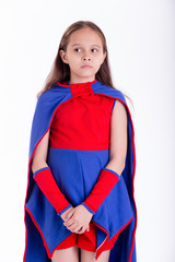 Girl in superhero costume looking worried