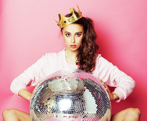 young cute disco girl on pink background with disco ball and cro