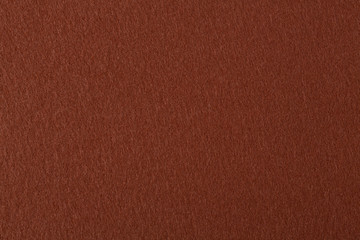 Fototapeta premium Natural dark brown felt texture.