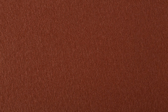 Natural dark brown felt texture.