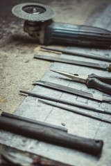 Tools lined up on a metal surface