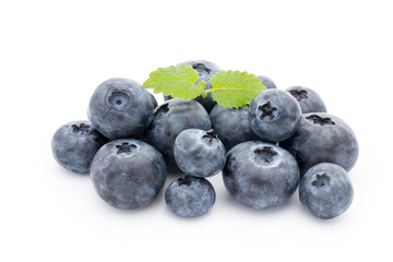 Close up of a blueberry branch isolated over white.
