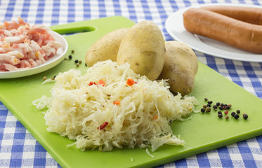 Ingredients for typical dutch dish zuurkool with sauerkraut and