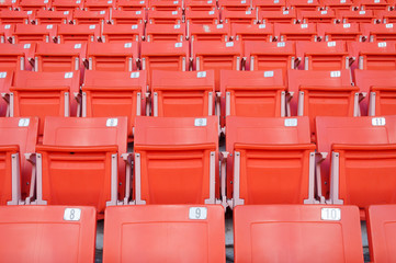 Naklejka premium Empty orange seats at stadium,Rows of seat on a soccer stadium