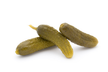 Marinated pickled cucumbers isolated on the white.