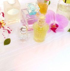 perfume bottles on the dressing table.different  bottles of perfume with orchid