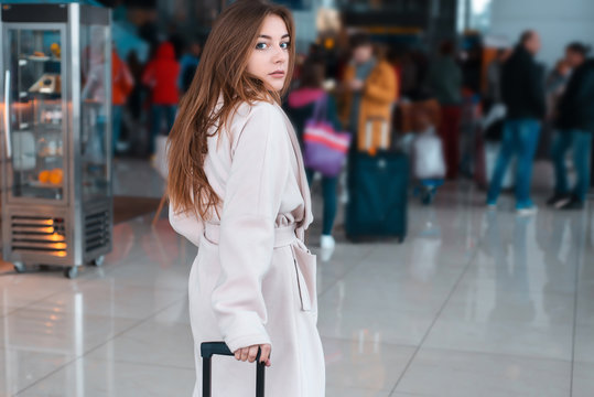 Young woman in the modern airport.