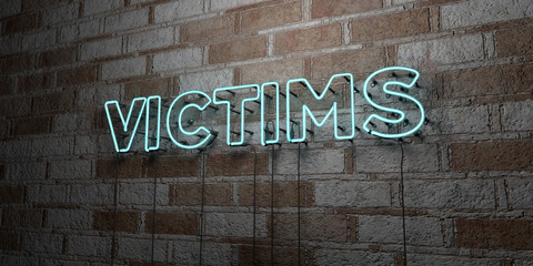 VICTIMS - Glowing Neon Sign on stonework wall - 3D rendered royalty free stock illustration.  Can be used for online banner ads and direct mailers..