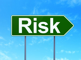 Business concept: Risk on road sign background