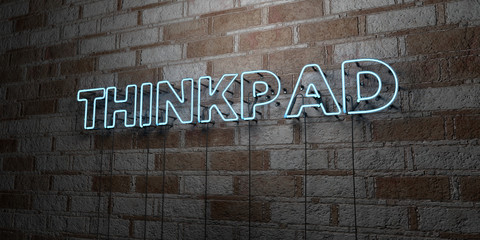 THINKPAD - Glowing Neon Sign on stonework wall - 3D rendered royalty free stock illustration.  Can be used for online banner ads and direct mailers..