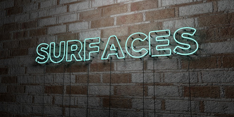 Fototapeta na wymiar SURFACES - Glowing Neon Sign on stonework wall - 3D rendered royalty free stock illustration. Can be used for online banner ads and direct mailers..