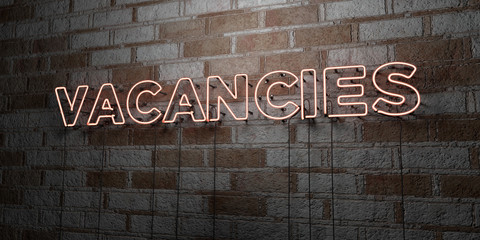 VACANCIES - Glowing Neon Sign on stonework wall - 3D rendered royalty free stock illustration.  Can be used for online banner ads and direct mailers..