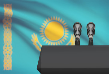 Pulpit and two microphones with a national flag on background - Kazakhstan