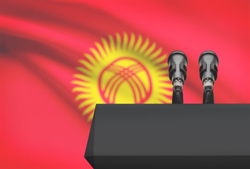 Pulpit and two microphones with a national flag on background - Kyrgyzstan