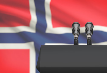 Pulpit and two microphones with a national flag on background - Norway