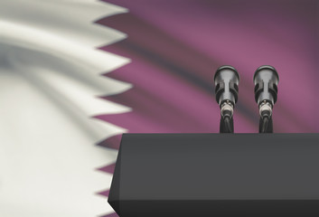 Pulpit and two microphones with a national flag on background - Qatar