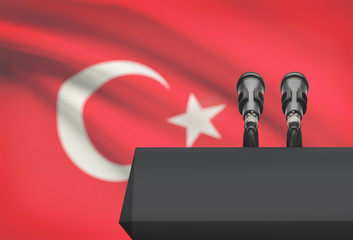 Pulpit and two microphones with a national flag on background - Turkey