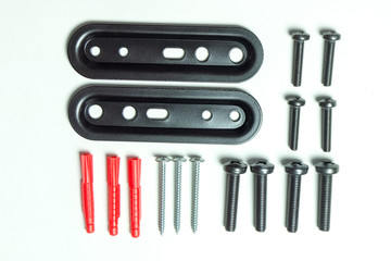 A variety of screws, plates, anchors laid next to each other on