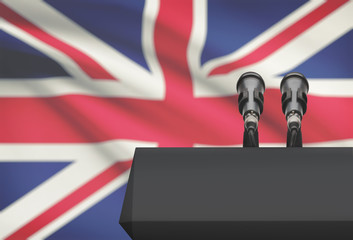 Pulpit and two microphones with a national flag on background - United Kingdom