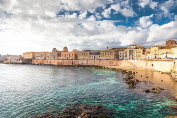 Ionian coast of Ortigia island, a part of Siracusa. Travel photo for a postcard. Sicily, Italy, Europe. - obrazy, fototapety, plakaty