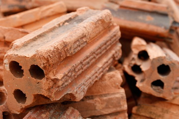 A pile of red brick closeup