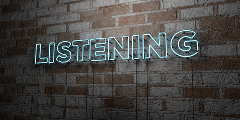 LISTENING - Glowing Neon Sign on stonework wall - 3D rendered royalty free stock illustration.  Can be used for online banner ads and direct mailers..